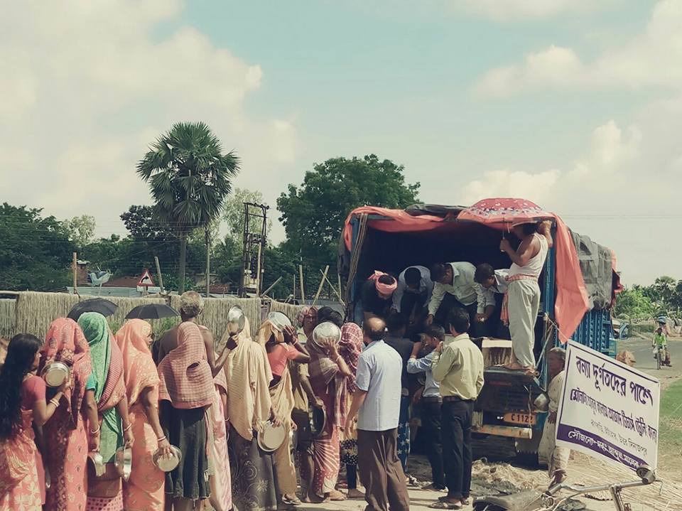 Relief truck and villagers